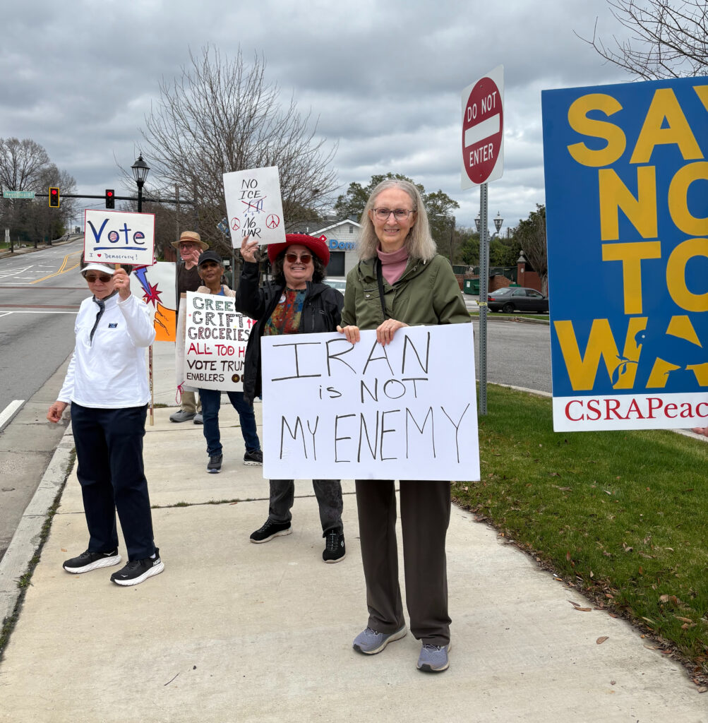 Protestors holding signs